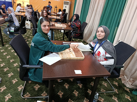 Pakistani players competing in Oware