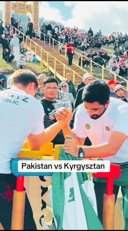 Pakistan Arm Wrestling athlete in competition against Kyrgyzstan